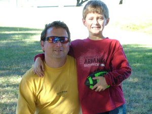 Me and my son after playing football somewhere other than our front yard.