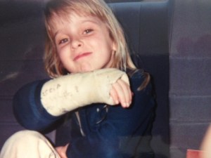 My daughter proudly displays her cast after getting it signed by several of her friends.