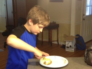 My son prepares to take a giant step in his life - trying a baked potato for the first time.