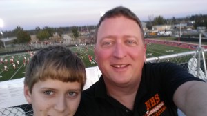 My son and I have found new ways to spend time together. Here we are on top of a press box before I broadcast a high school football game.